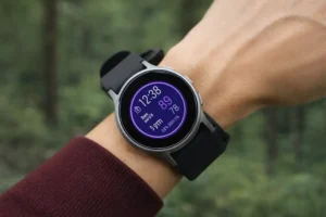 Close up of a wrist with a smartwatch for seniors showing health stats.